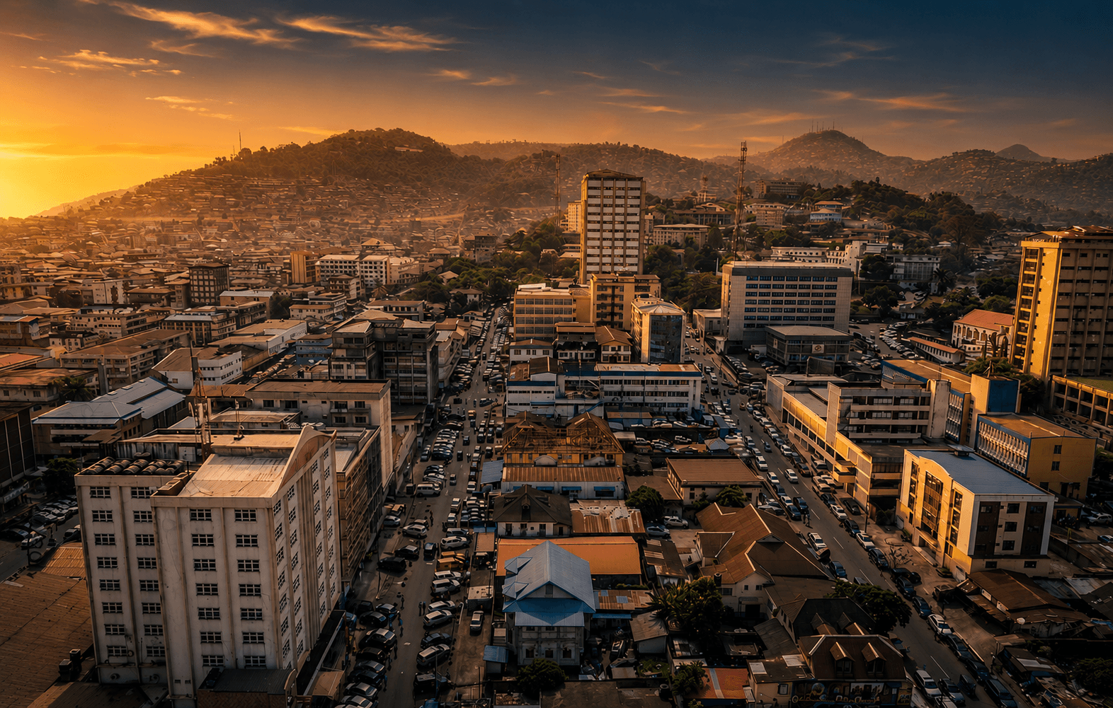 Freetown, Sierra Leone at golden hour — the city catching the last light of the day from a hillside vantage